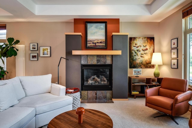 6846 Frank Lloyd Wright Ave, Middleton, WI 53562 - living area with carpet floors, a tile fireplace, and a raised ceiling