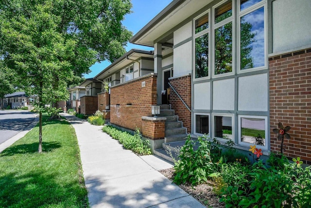 6846 Frank Lloyd Wright Ave, Middleton, WI 53562 - view of home's exterior with brick siding and a residential view