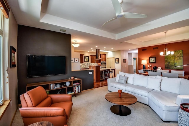 6846 Frank Lloyd Wright Ave, Middleton, WI 53562 - living area featuring a chandelier, light colored carpet, a ceiling fan, recessed lighting, and a tray ceiling