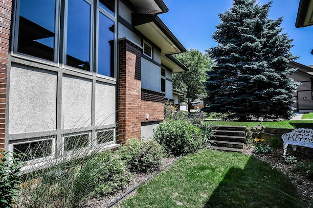 6846 Frank Lloyd Wright Ave, Middleton, WI 53562 - view of side of property featuring brick siding and stucco siding