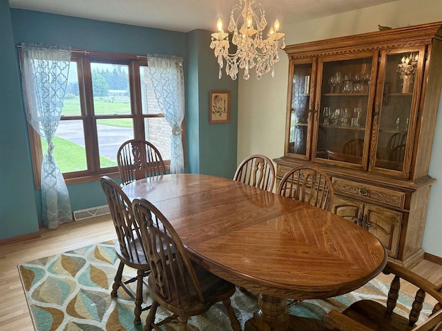 38630 Golf View Dr, Prairie Du Chien, WI 53821 - dining room with a chandelier and light wood-style floors