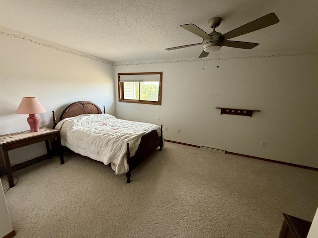 38630 Golf View Dr, Prairie Du Chien, WI 53821 - bedroom with light carpet, ceiling fan, and a textured ceiling