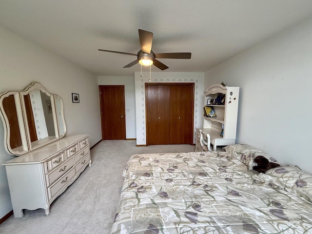 38630 Golf View Dr, Prairie Du Chien, WI 53821 - bedroom featuring light colored carpet, ceiling fan, and a closet