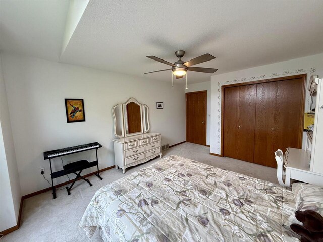 38630 Golf View Dr, Prairie Du Chien, WI 53821 - bedroom with light colored carpet and ceiling fan