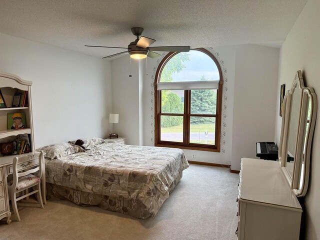 38630 Golf View Dr, Prairie Du Chien, WI 53821 - bedroom featuring light colored carpet, ceiling fan, and a textured ceiling