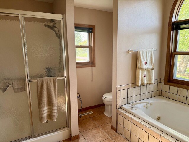 38630 Golf View Dr, Prairie Du Chien, WI 53821 - full bathroom with a shower stall, a whirlpool tub, and tile patterned floors