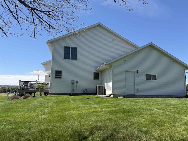 38630 Golf View Dr, Prairie Du Chien, WI 53821 - back of property with a wooden deck and a lawn