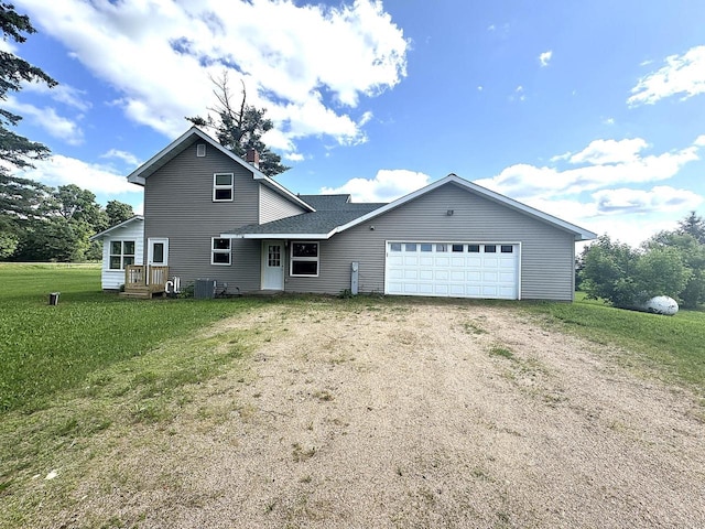 N5516 Polar Rd, Bryant, WI 54418 - view of front of property with driveway, a garage, a front yard, and a chimney