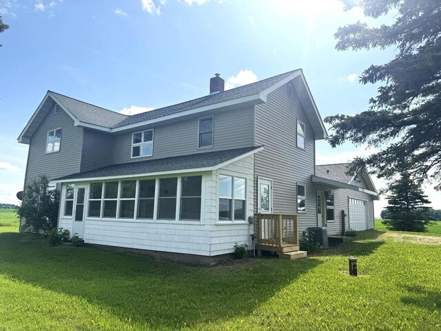 N5516 Polar Rd, Bryant, WI 54418 - rear view of property featuring a shingled roof, a chimney, and a yard
