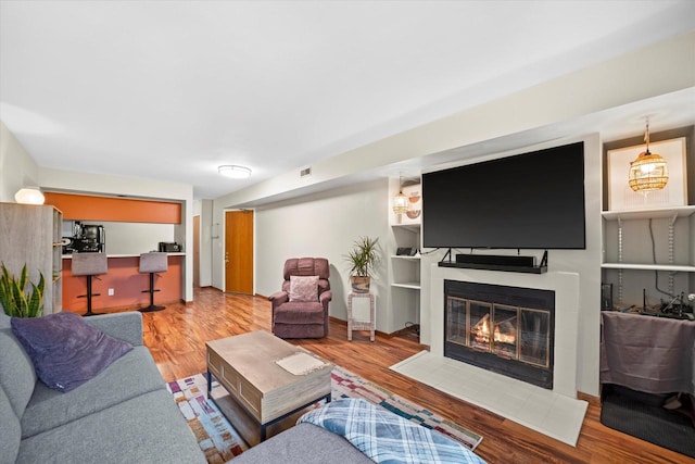847 W Puetz Rd, Oak Creek, WI 53154 - living area featuring wood finished floors and a large fireplace