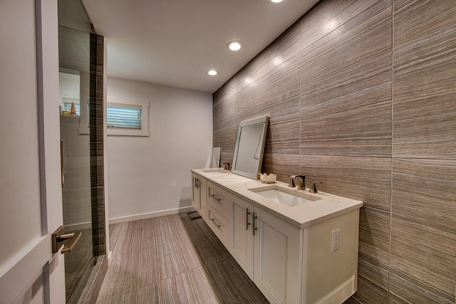 915 Mariane Ter, Lake Geneva, WI 53147 - bathroom featuring double vanity, recessed lighting, and tile walls