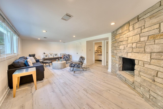 915 Mariane Ter, Lake Geneva, WI 53147 - living room featuring wood finished floors, a stone fireplace, and recessed lighting