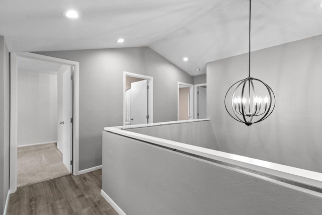 102 Crab Apple Ct, Appleton, WI 54914 - hallway with dark wood-type flooring, a chandelier, vaulted ceiling, and recessed lighting
