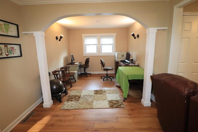 1503 St Lawrence Ave, Beloit, WI 53511 - office space featuring arched walkways, decorative columns, wood finished floors, and crown molding