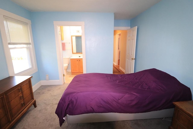 1503 St Lawrence Ave, Beloit, WI 53511 - carpeted bedroom featuring baseboards and ensuite bathroom