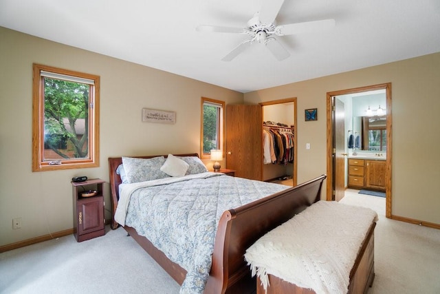 4129 Birch Crest Ln, Eau Claire, WI 54701 - bedroom featuring light carpet, a spacious closet, a closet, and connected bathroom