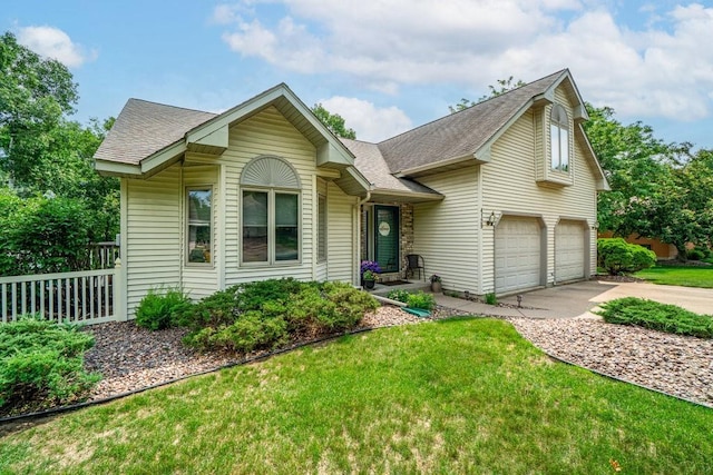 4129 Birch Crest Ln, Eau Claire, WI 54701 - view of front of house with a garage, concrete driveway, and a shingled roof