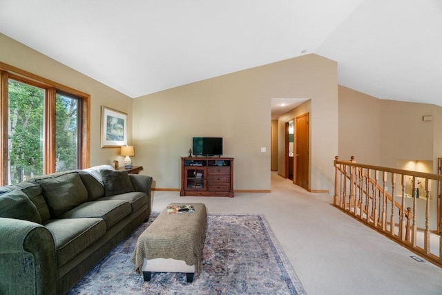 4129 Birch Crest Ln, Eau Claire, WI 54701 - carpeted living area with lofted ceiling and baseboards