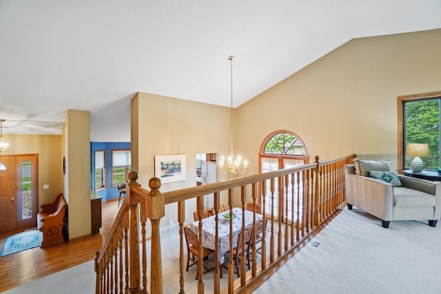 4129 Birch Crest Ln, Eau Claire, WI 54701 - corridor with a chandelier, an upstairs landing, high vaulted ceiling, plenty of natural light, and wood finished floors