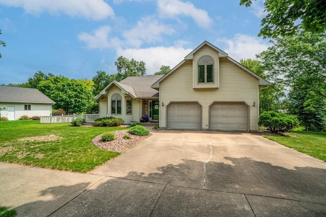 4129 Birch Crest Ln, Eau Claire, WI 54701 - traditional home featuring a garage and concrete driveway