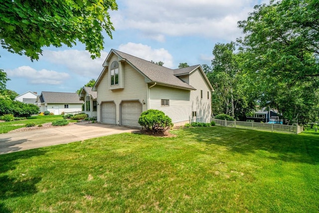4129 Birch Crest Ln, Eau Claire, WI 54701 - view of side of home featuring a garage, driveway, and roof with shingles