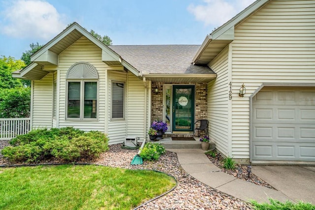 4129 Birch Crest Ln, Eau Claire, WI 54701 - property entrance featuring a shingled roof and a garage