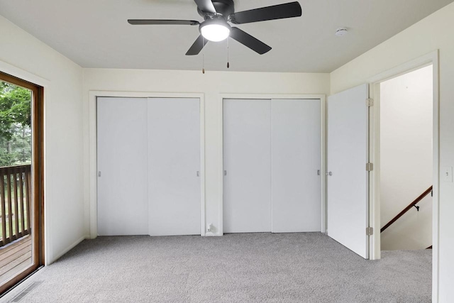 W2726 Marion St, Neshkoro, WI 54960 - unfurnished bedroom featuring two closets, carpet, and a ceiling fan