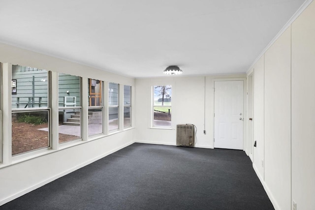 W2726 Marion St, Neshkoro, WI 54960 - spare room featuring baseboards and dark colored carpet
