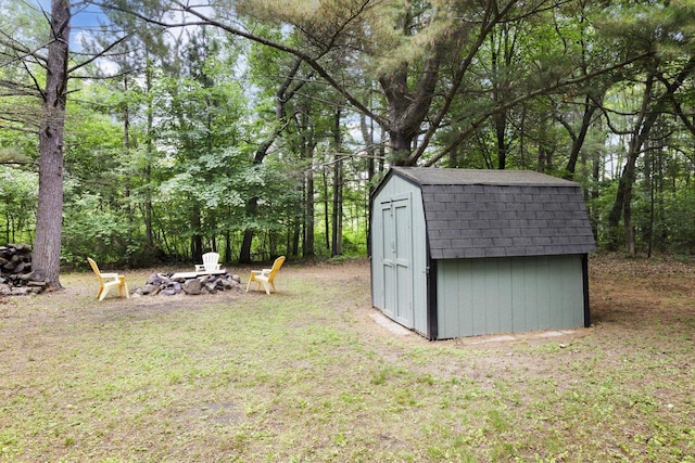 W2726 Marion St, Neshkoro, WI 54960 - view of green lawn with an outdoor fire pit and a storage shed
