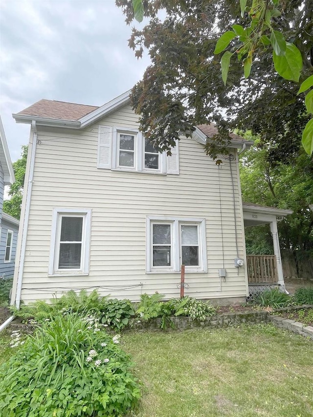 133 W 16th Ave, Oshkosh, WI 54902 - view of property exterior featuring a lawn