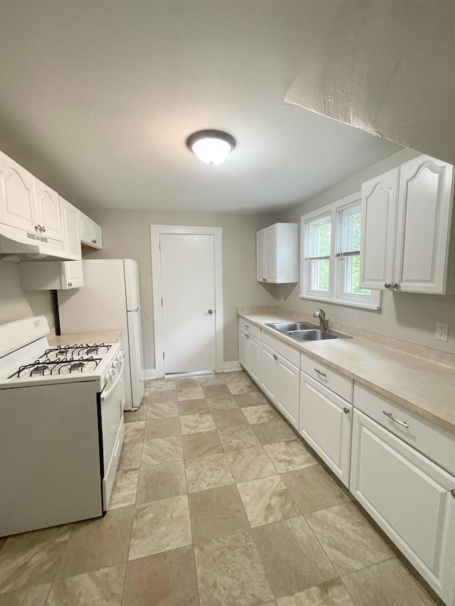 133 W 16th Ave, Oshkosh, WI 54902 - kitchen with gas range gas stove, under cabinet range hood, white cabinets, and light countertops