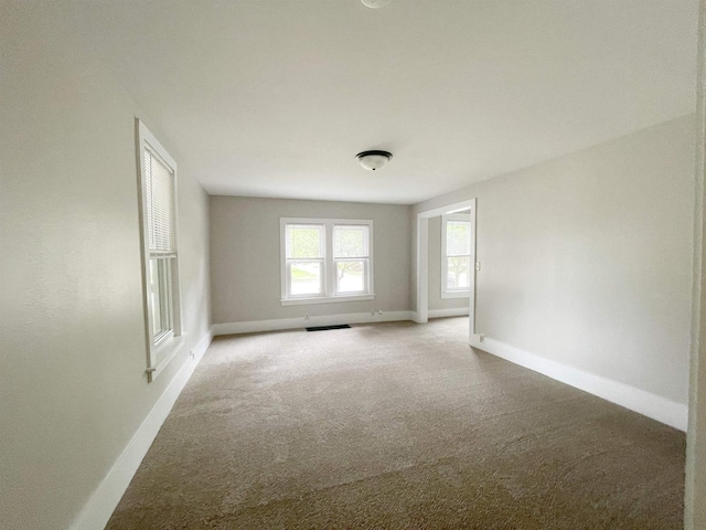133 W 16th Ave, Oshkosh, WI 54902 - carpeted empty room with baseboards