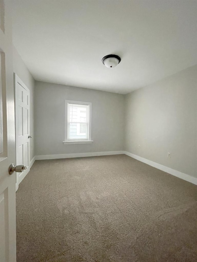 133 W 16th Ave, Oshkosh, WI 54902 - unfurnished room featuring carpet flooring and baseboards
