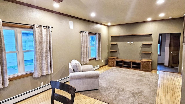 553 W 17th Ave, Oshkosh, WI 54902 - living area with a textured wall, wood finished floors, a baseboard heating unit, crown molding, and recessed lighting