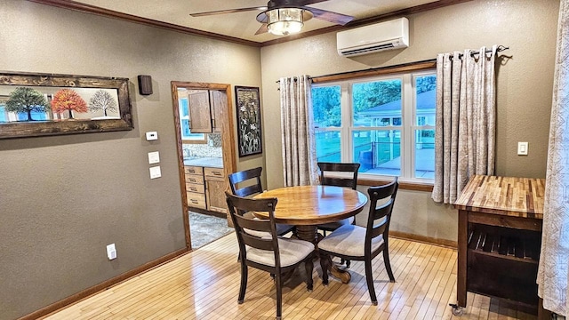 553 W 17th Ave, Oshkosh, WI 54902 - dining area featuring an AC wall unit, a textured wall, crown molding, light wood finished floors, and ceiling fan