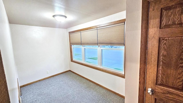 553 W 17th Ave, Oshkosh, WI 54902 - unfurnished room with carpet floors and baseboards