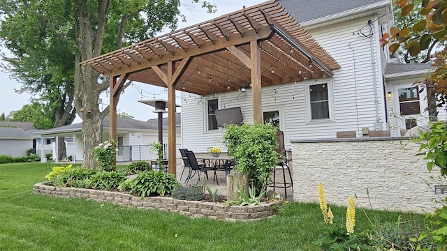 553 W 17th Ave, Oshkosh, WI 54902 - back of property featuring a pergola, a lawn, and a patio