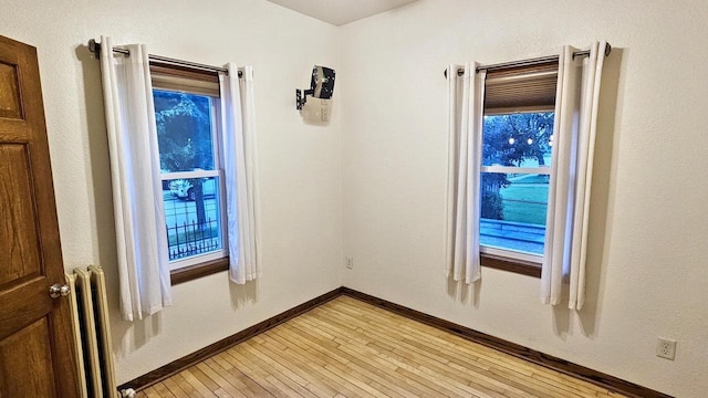553 W 17th Ave, Oshkosh, WI 54902 - unfurnished room featuring light wood-style floors and baseboards