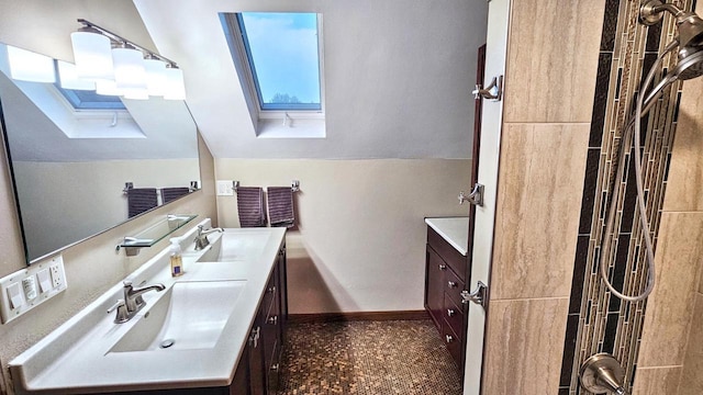 553 W 17th Ave, Oshkosh, WI 54902 - bathroom featuring vanity, a skylight, and vaulted ceiling
