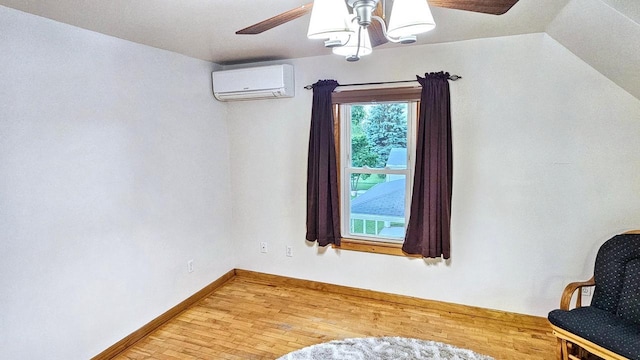 553 W 17th Ave, Oshkosh, WI 54902 - sitting room featuring an AC wall unit, a ceiling fan, and light wood-style flooring