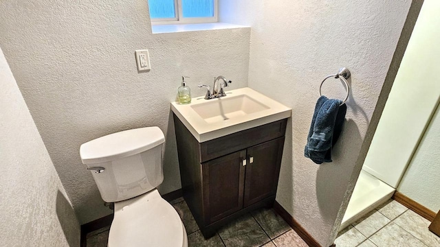 553 W 17th Ave, Oshkosh, WI 54902 - bathroom with vanity, a textured wall, and tile patterned floors