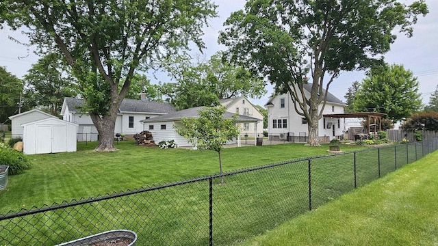 553 W 17th Ave, Oshkosh, WI 54902 - fenced backyard with a storage unit