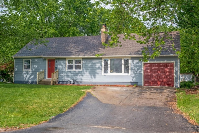 11114 8th Ave, Pleasant Prairie, WI 53158 - view of front of property with entry steps, a front lawn, a chimney, an attached garage, and driveway