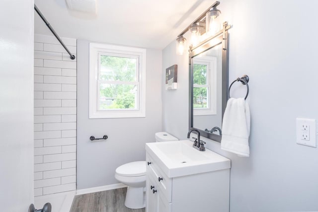 11114 8th Ave, Pleasant Prairie, WI 53158 - full bath with vanity, a shower, wood finished floors, and plenty of natural light