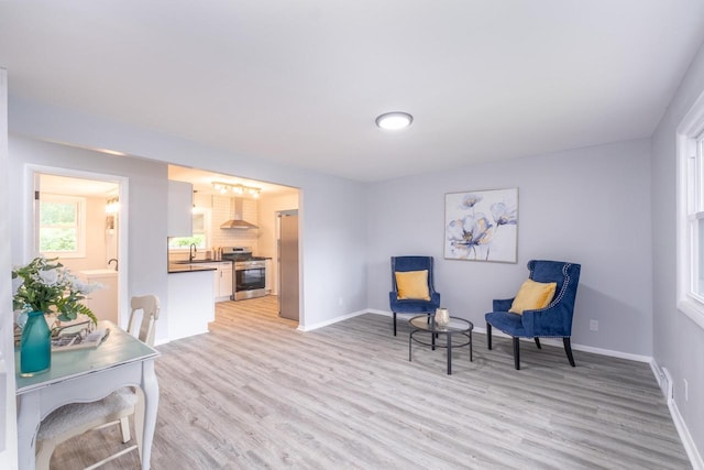 11114 8th Ave, Pleasant Prairie, WI 53158 - sitting room with light wood finished floors and baseboards