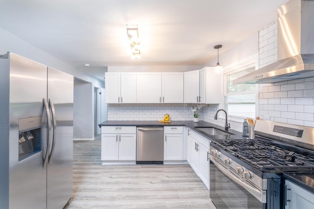 11114 8th Ave, Pleasant Prairie, WI 53158 - kitchen with stainless steel appliances, wall chimney range hood, decorative backsplash, and white cabinets