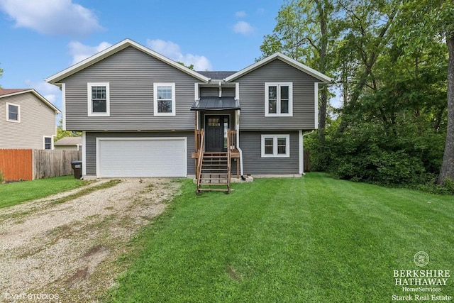 W1018 Larkspur Rd, Genoa City, WI 53128 - raised ranch featuring dirt driveway and a garage