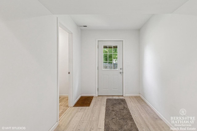 W1018 Larkspur Rd, Genoa City, WI 53128 - doorway featuring light wood finished floors and baseboards