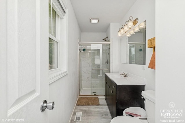 W1018 Larkspur Rd, Genoa City, WI 53128 - full bath featuring vanity, a stall shower, and wood finished floors