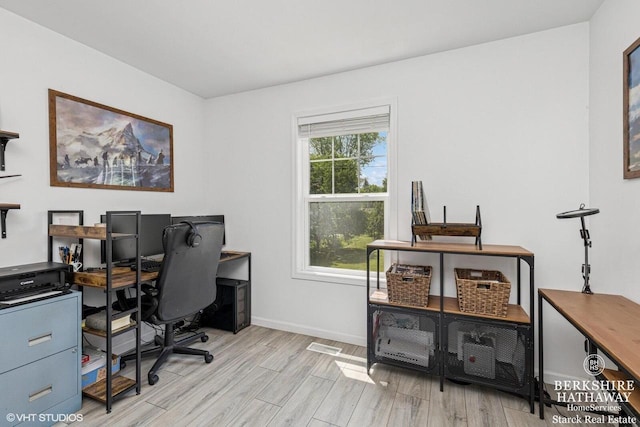 W1018 Larkspur Rd, Genoa City, WI 53128 - home office featuring light wood-style flooring and baseboards
